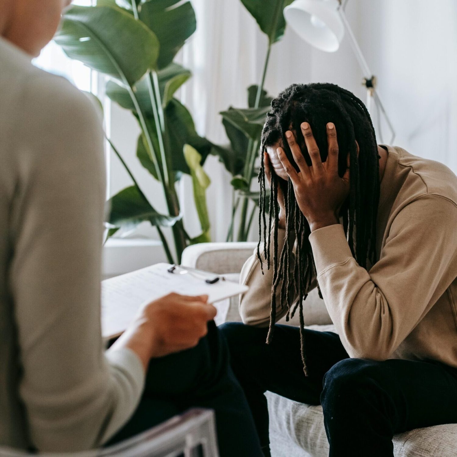 A concerned client in therapy, seeking professional support and guidance indoors.